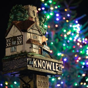 Knowle Christmas tree with Knowle's millenium statue in the foreground